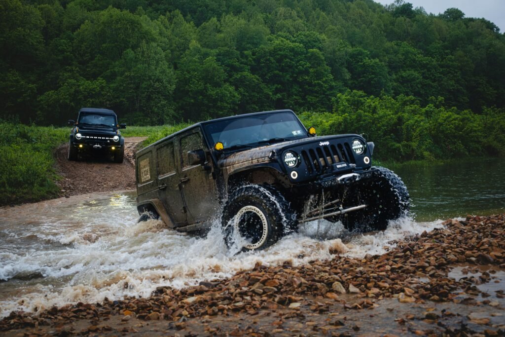 off-road vehicle crossing a jungle river