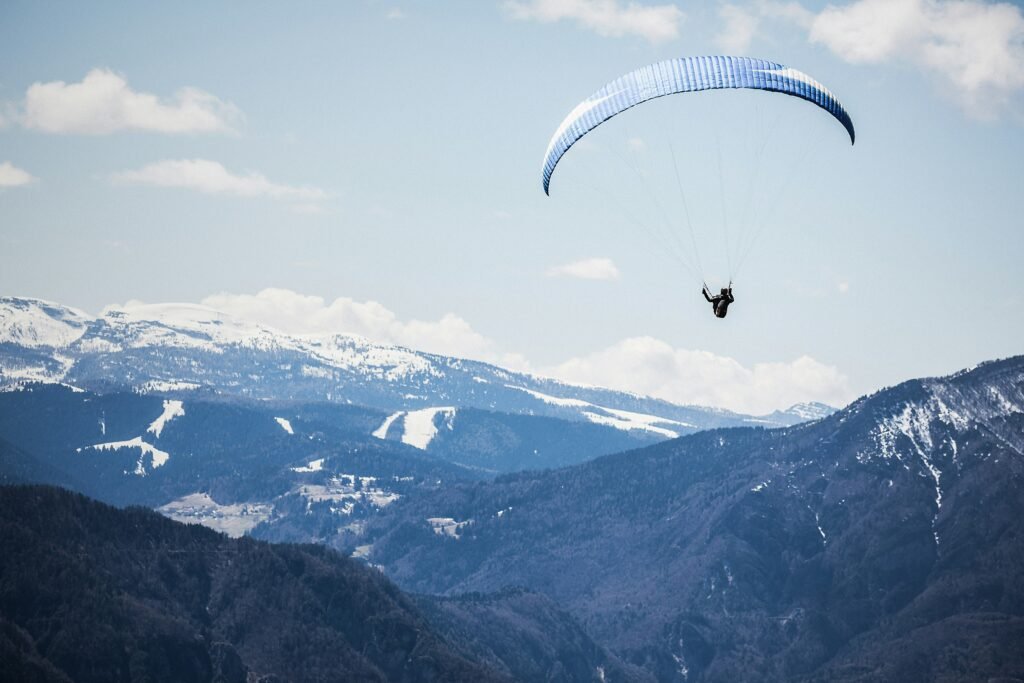 paraglider-in-flight-in-mountains