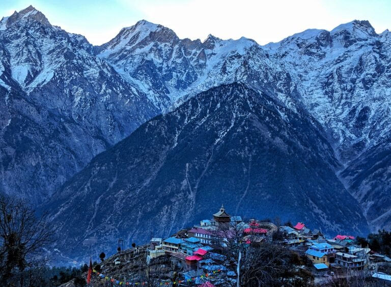 snow-peaked-mountain-and-village-in-explore-himachal-pradesh-guide