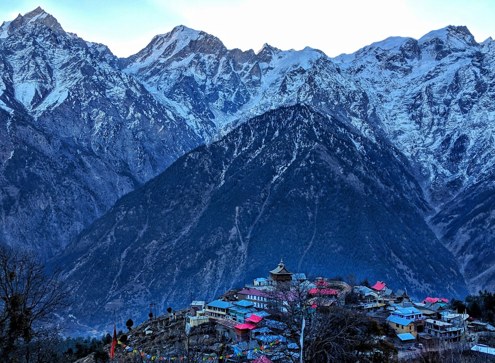 snow-peaked-mountain-and-village-in-explore-himachal-pradesh-guide