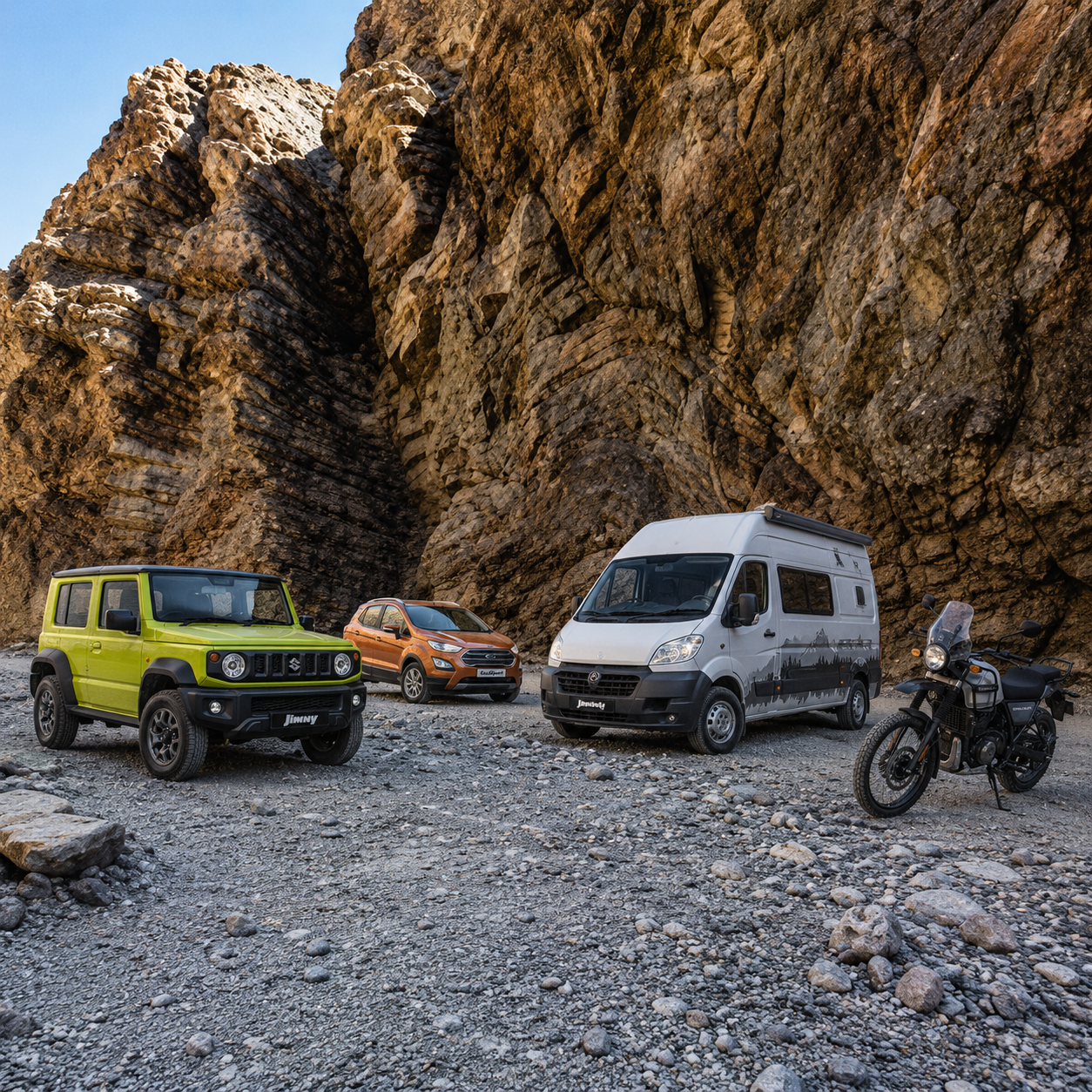 jimny-ecosport-campaervan-motorbike-parked-by-mountain-road