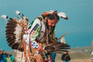 tribal-woman-wearing-feather-props-immersive-cultural-travel-experiences