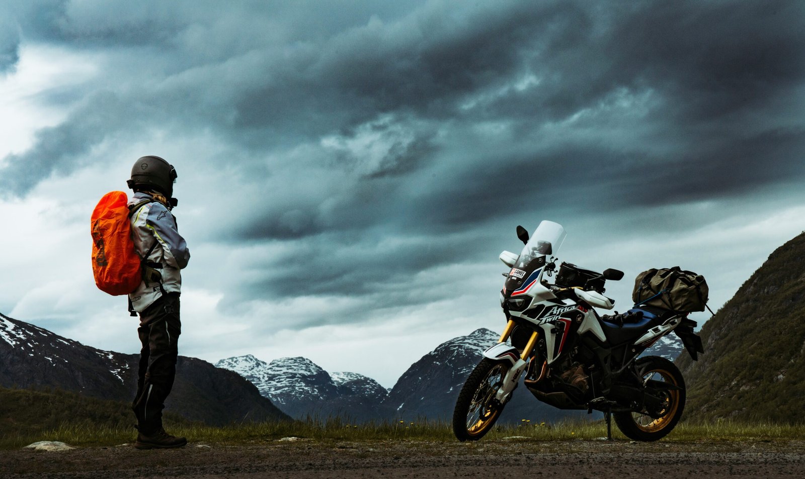 rider-looking-at-his-expedition-motorcycle-expedition-planning