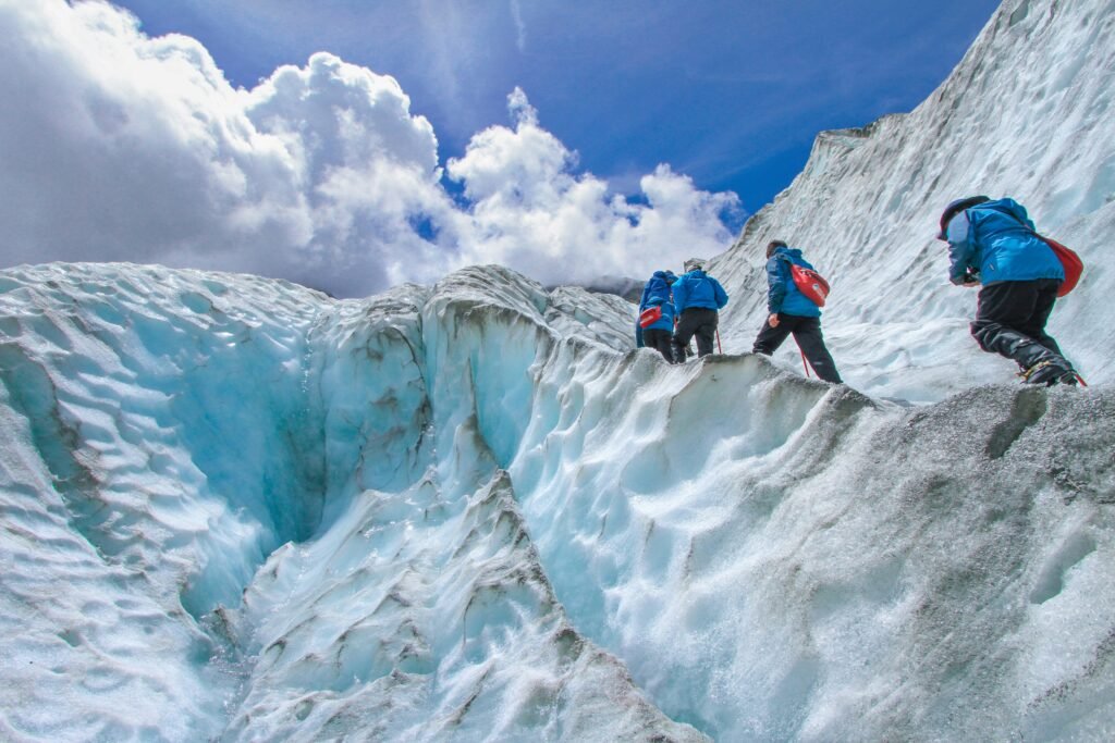 group-of-trekkers-climbing-a-glacier-best-adventure-travel-experiences